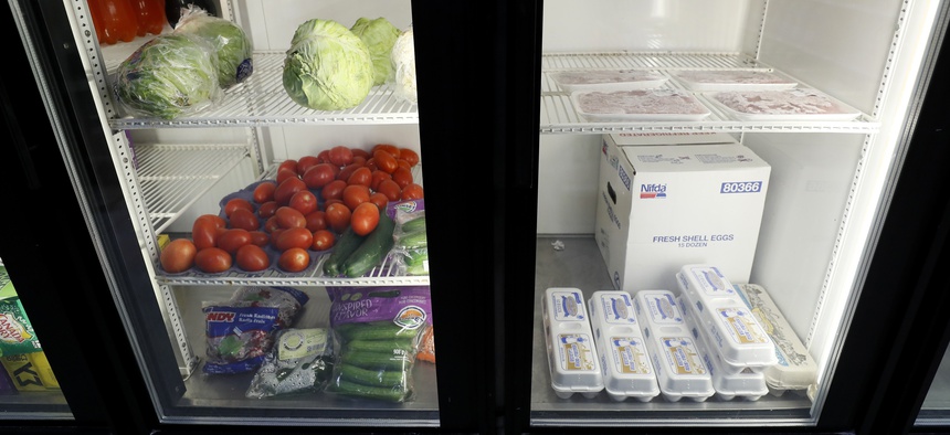 Produce, meat and eggs sit in a cooler at a local super market, Friday, May 29, 2020, in Des Moines, Iowa.