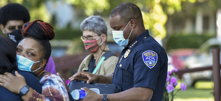 Rochester Police Chief La'Ron Singletary, right, seen before a community meeting in Rochester, N.Y., on Sept. 3, 2020.