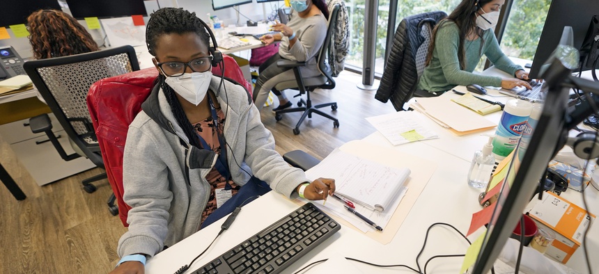 Contact tracers, from left to right, Christella Uwera, Dishell Freeman and Alejandra Camarillo work at Harris County Public Health contact tracing facility Thursday, June 25, 2020, in Houston.