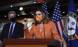 Rep. Frank Pallone, D-N.J., left, listens as Speaker of the House Nancy Pelosi, D-Calif., speaks with reporters at the Capitol in Washington, Thursday, Oct. 8, 2020.