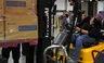 Oklahoma Gov. Kevin Stitt, rear, watches as a forklift operator loads boxes of PPE for Edmond Public Schools at the Central Oklahoma PPE distribution warehouse on Aug. 18, 2020, in Oklahoma City. 