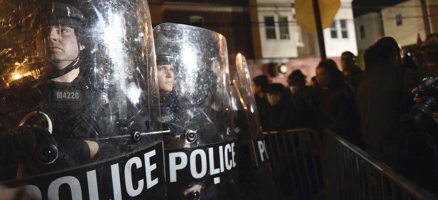 Philadelphia police officers form a line during a demonstration in Philadelphia, late Tuesday, Oct. 27, 2020.