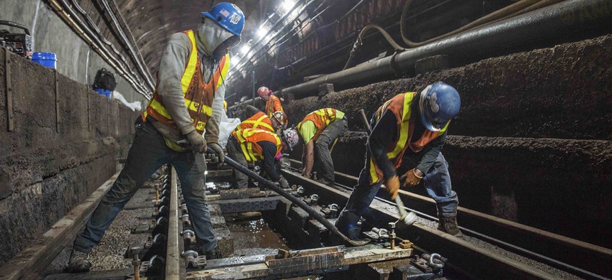 This June 15, 2019 photo provided by the Metropolitan Transportation Authority shows workers during the L Project subway tunnel rehabilitation, in New York.