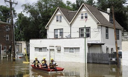 First responders make their way through floodwaters in Darby, Pa., Monday, Aug. 13, 2018. 