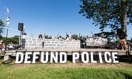 Activists call for defunding the police at a protest in Minneapolis in June.
