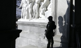 A Capitol police officer stands at the front entrance of the Pennsylvania Capitol building Tuesday Jan. 12, 2021, in Harrisburg, Pa.