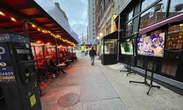 Patrons watch sports outside in the frigid January 2021 weather as dining is restricted to 'outdoors onl'y during the coronavirus pandemic in New York City.