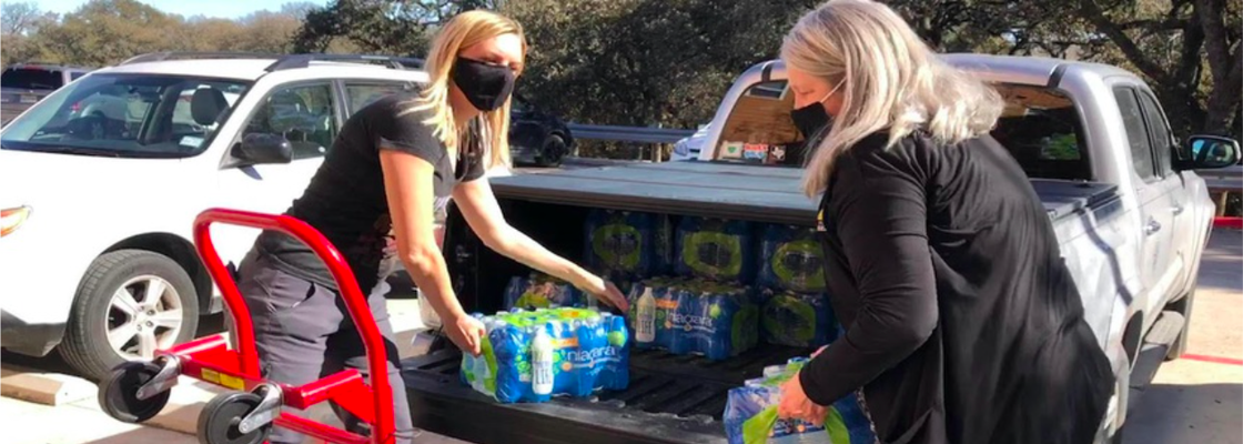Austin City Council Member Paige Ellis, left, used her fiance's truck to distribute water to constituents during severe winter storms in Texas.