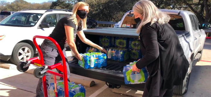 Austin City Council Member Paige Ellis, left, used her fiance's truck to distribute water to constituents during severe winter storms in Texas.