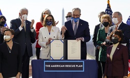 House Speaker Nancy Pelosi of Calif., and Senate Majority Leader Chuck Schumer of N.Y., poses after signing the $1.9 trillion COVID-19 relief bill during an enrollment ceremony on Capitol Hill, Wednesday, March 10, 2021, in Washington.