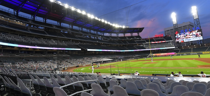 Cardboard cutouts of fans in the otherwise empty seats face the field during the sixth inning of a baseball game between the Atlanta Braves and Tampa Bay Rays in Atlanta, in this Thursday, July 30, 2020, photo.