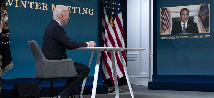 In this Feb. 25, 2021, photo, President Joe Biden listens as Gov. Andrew Cuomo, D-N.Y., speaks during a virtual meeting of the National Governors Association, in the South Court Auditorium on the White House campus in Washington.